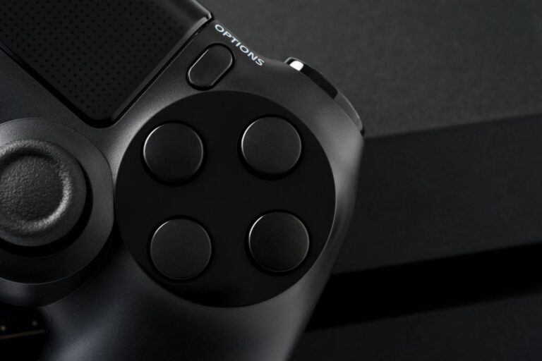 Close-up of a black game controller and its buttons