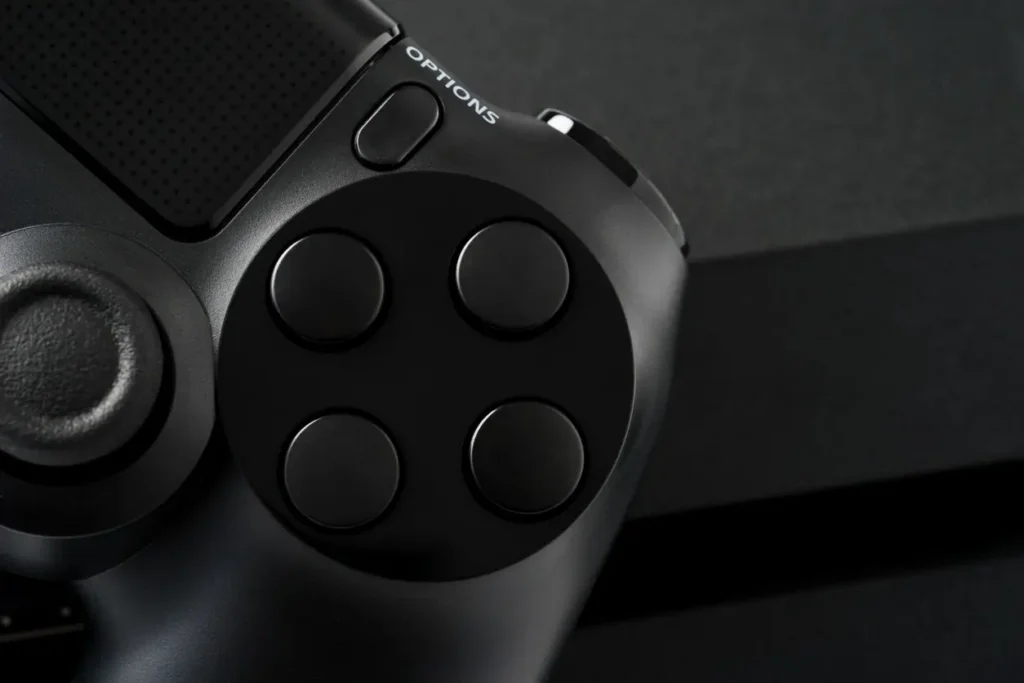 Close-up of a black game controller and its buttons