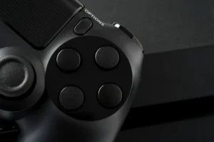 Close-up of a black game controller and its buttons